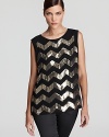 Sparkling chevron stripes lend disco-era glamour to a VINCE CAMUTO blouse for a retro-chic statement.