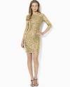 A simple bateau neckline dress is made ultra-glamorous with a sequined overlay and chic three-quarter-length sleeves.