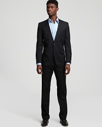 Suitable for the boardroom and the best man, this pinstripe suit in lightweight virgin wool is a wardrobe staple. Fully lined jacket has notched lapel, front flap pockets and 2-button closure. Pant has flat front, black slit pockets and zip fly.