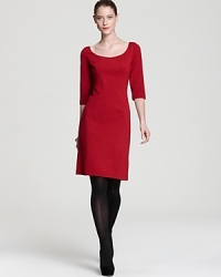 Add a punch of modernity to your 9-to-5 repertoire with a minimalist Elie Tahari dress. Keep the look streamlined with sheer tights for sharp edge.