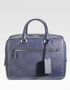 Sleek and sophisticated in textured saffiano leather with a double-zip closure. Leather handles Leather luggage tag Exterior zip pocket Interior zip pocket Fully lined 15¾W X 11H X 7D Made in Italy