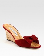 Natural cork wedge with a suede upper and bow adornment. Cork-covered wedge, 2¾ (70mm)Suede and natural cork upperBuffed leather soleMade in ItalyOUR FIT MODEL RECOMMENDS ordering one half size up as this style runs small. 