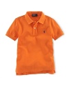 A short-sleeved polo shirt is cut in soft breathable cotton mesh.