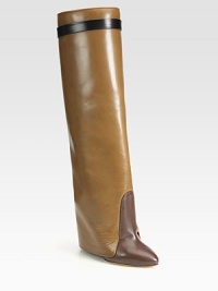 Sleek multicolored boot of supple leather, with a unique fold-over cuff and hidden lacquered wedge. Lacquered wedge with covered leather flap, 6 (150mm)Shaft, 19¾Leg circumference, 13½Leather upperPull-on styleLeather lining and solePadded insoleMade in Italy