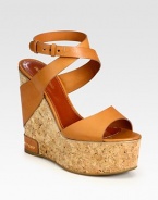 Italian leather straps surround an earthy cork wedge and platform. Cork and leather wedge, 5 (125mm)Cork platform, 2 (50mm)Compares to a 3 heel (75mm)Leather upperLeather liningRubber solePadded insoleMade in Spain