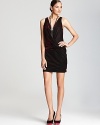 Aqua's lush velvet dress shifts from black to fuchsia with every step, shimmering in a sleeveless faux wrap silhouette.