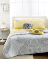 A grand presentation with a modern twist. This Victoria duvet cover set features a traditional flourish pattern in tonal hues with pops of black and yellow for a whimsical, contemporary touch.