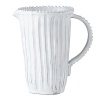 Handmade and inspired by the maestro artisan's family heirloom dinnerware, this stripe pitcher makes a rustically sophisticated dining statement.