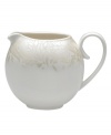 A soft, feminine look with Denby durability, the Lucille Gold creamer promises lasting style and modern grace. In a pattern inspired by vintage lace and designed by English stylemaker, Monsoon, shimmering gold swirls adorn creamy porcelain in this set of dinnerware. The dishes are beautiful for every day and occasion.