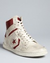 A retro-cool high top from Converse by John Varvatos, fully distressed for an authentic look on and off the court.