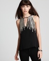 Shine on in this Parker top with sparkling, silver beading. Wear it with sleek leather leggings for a perfect party look!