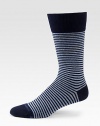 A distinguished stripe pattern is offset by a solid top trim and shaped in a soft cotton blend.Mid-calf height70% cotton/28% polyester/2% elasticMachine washImported