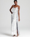 Covered in shimmering silver sequins, Aqua's floor-length dress lends a glam look.