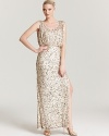 Floor-sweeping sequins make a sparkling impact on this Aidan Mattox gown, topped off with an elegant blouson bodice.