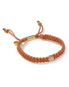 Weave haute hippie flair into your look with Michael Kors's braided leather bracelet. Slip on the high-texture style with a billowy blouse, flares and a foxy attitude.