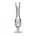 A sublime vase in elegant crystal hosts a simple rose or tulip for a classic display of grace and beauty.