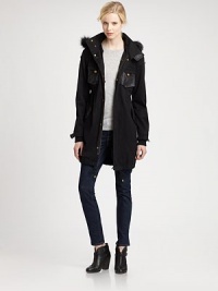 Versatile parka with a fox fur collar and inner removable rabbit fur vest for added warmth.