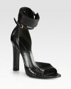 Textured lizard-print leather forms this tall ankle strap silhouette for a dramatic effect. Self-covered heel, 4½ (115mm)Lizard-print leather upperAdjustable ankle strapsLeather lining and solePadded insoleImported