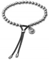 Who needs a stylist? Incorporate haute designer accessories into your look with a little Michael Kors. Celebrity-inspired, this good luck bracelet is crafted in silver tone mixed metal with an adjustable grey leather closure. Bracelet also stretches to fit wrist. Approximate diameter: 2-1/2 inches.