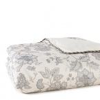 A soft palette and a floral print make this cotton comforter easy on the eyes. Features a striped print on reverse.