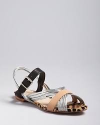 You'll have a soft spot for these wildly cute Loeffler Randall sandals. In step with the mixed media trend, they combine neutral and metallic straps with statement-making calf hair.