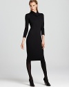 Cut a sleek silhouette in a knit Armani Collezioni dress, featuring a wrap collar, elbow sleeves and concealed front zipper. Wear it up during office hours and down to reveal some skin come evenings.