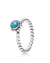 This birthstone ring features a beaded silver band with a polished turquoise solitaire. Perfect worn on its own or stacked with other PANDORA pieces.