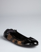 Darkly sophisticated, smoked check plaid and patent leather combine to give these Burberry ballerina flats edge.