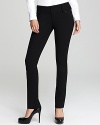 Leather trim lends a luxe edge to these Alice + Olivia slim pants, designed in stretch wool for a sleek silhouette.