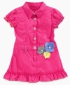 Big details for your little girl will keep her dancing through the day in this comfortable ruffle dress from Guess.