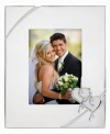 Preserve a cherished moment of your own or treat your favorite newlyweds to the True Love picture frame. Interlocking hearts adorn elegant silver plate, a beautiful showcase for wedding or honeymoon photos.