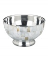 Enhance the elegant style of any table with the beauty of Mother of Pearl. Beveled stainless steel trim surrounds this attractive nut bowl with classic style, only from Lauren by Ralph Lauren.