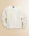 Crafted from ultra-cozy fleece in a classic crewneck silhouette, this essential sweatshirt is adorned with stitched-on USA for a time-honored, patriotic appeal.Crewneck with v-insetLong sleevesPullover style87% cotton/13% polyesterMachine washImported