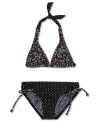 Sunny style. Give her look a fun turn with this print halter top and bottoms two-piece swimsuit from Roxy.