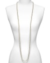 Majorica 8mm round white pearl Endless necklace. Long necklace made from organic man made pearls from Mallorca, Spain. Hand knotted in between pearls and no closure. Approximately 60 long. Wear long as single strand or layer for a dramatic look. Shown wrapped three times.