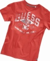 This Guess tee has a faded look and 1981 emblem giving it a cool vintage vibe.