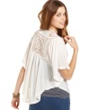 A bohemian-cool crochet-knit back inset brings this batwing sleeve cardigan to life! From Planet Gold.