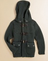 A rustic hip-length layer in a chunky waffle knit with a versatile detachable hood and preppy toggle details.Detachable button hoodRibbed stand collarLong sleeves with ribbed cuffsElbow patch detailFront toggle closureFront patch button pocketsRibbed hem80% wool/20% nylonHand washMade in Italy