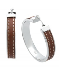 Traditional hoop earrings experience a taste of added luxury. Lauren by Ralph Lauren's trendy style incorporates a brown leather wrapping with a stitched overlay. Set in silver tone mixed metal. Approximate diameter: 1-1/4 inches.