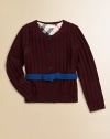 A wide ribbed texture and a contrast ribbon with a bow give this merino wool sweater its pretty panache.Round ribbed necklineLong sleeves with ribbed cuffsContrast attached self beltButton placketWide ribbed hemMerino woolDry cleanImported Please note: Number of buttons may vary depending on size ordered. 