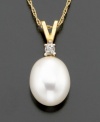 Supreme sophistication. A freshwater pearl (8-10 mm) with diamond accents beams on 14k gold V-shaped bale. Chain measures 16 inches; drop measures 5/8 inch.