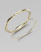 A simple, sophisticated, substantial bangle of 18k yellow gold with a rich hammered texture. 18k yellow gold Diameter, about 2½ Imported Please note: Bracelets sold separately.