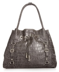 Every urban-jungle ensemble deserves exotic appeal, like this croc-embossed tote from Jessica Simpson. The spacious design is outfitted with gleaming hardware and buckle accents, while the interior flaunts multiple pockets for effortless on-the-go style.