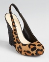 A glitter-covered wedge heel compliments leopard print haircalf on the GUESS Russo slingbacks.