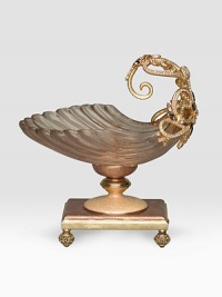 Put your soap up on a pedestal, topped by an opulent hand-enameled shell, accented with shimmering hand-set Swarovski crystals. 10k goldplated pewter with enamel and crystal 6¼W X 6¼H X 4½D Made in USA