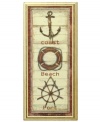 Stay close to the shore with this rustic wall art. Distressed wood and icons of the coast, beach and port steer your decor on a nautical course.