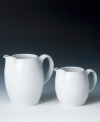 The clean, crisp lines and cool, glazed hue of this small jug (shown right) from Denby's white dinnerware and dishes collection will infuse your tabletop with modern style. 0.4 liter.