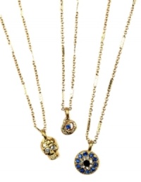 Mystical and mysterious, RACHEL Rachel Roy's trio necklace conveys edgy glamour with skull, snake and evil eye pendants. Made in gold tone mixed metal with glass crystal accents. Approximate length: 18 inches + 2-inch extender. Approximate drop: 1/2 inch to 1 inch.