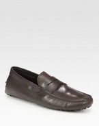 An easy-going moccasin style is crafted with great detail in fine leather. Leather lining Driver sole Made in Italy 