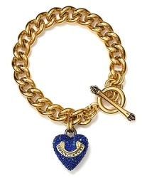 Juicy Couture's signature starter bracelet feauturing a pavé heart charm with logo banner.